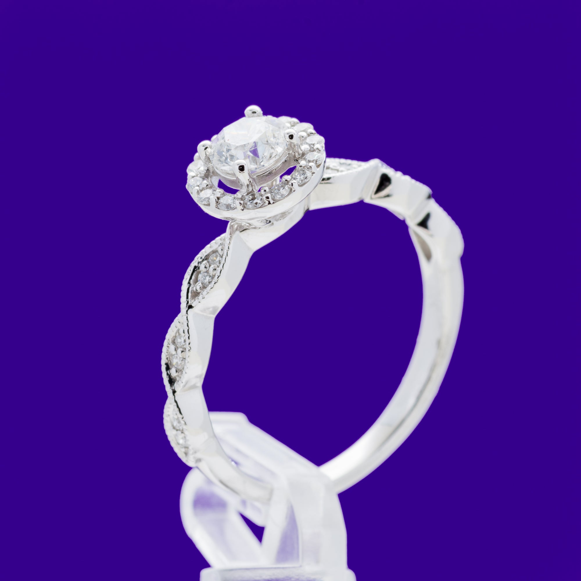 9ct White Gold .60ct Solitare Halo with pave twisted shoulders and matching Wedding band