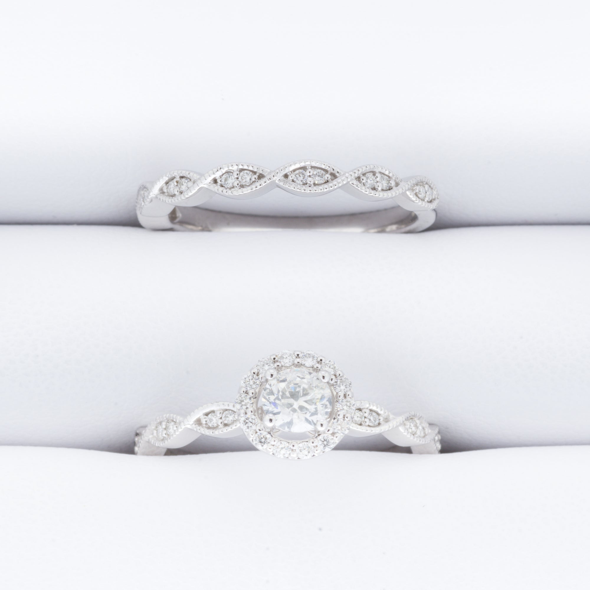 9ct White Gold .60ct Solitare Halo with pave twisted shoulders and matching Wedding band